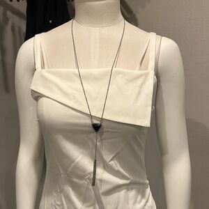 Long chain metal necklace with triangle black center metal chains also hanging